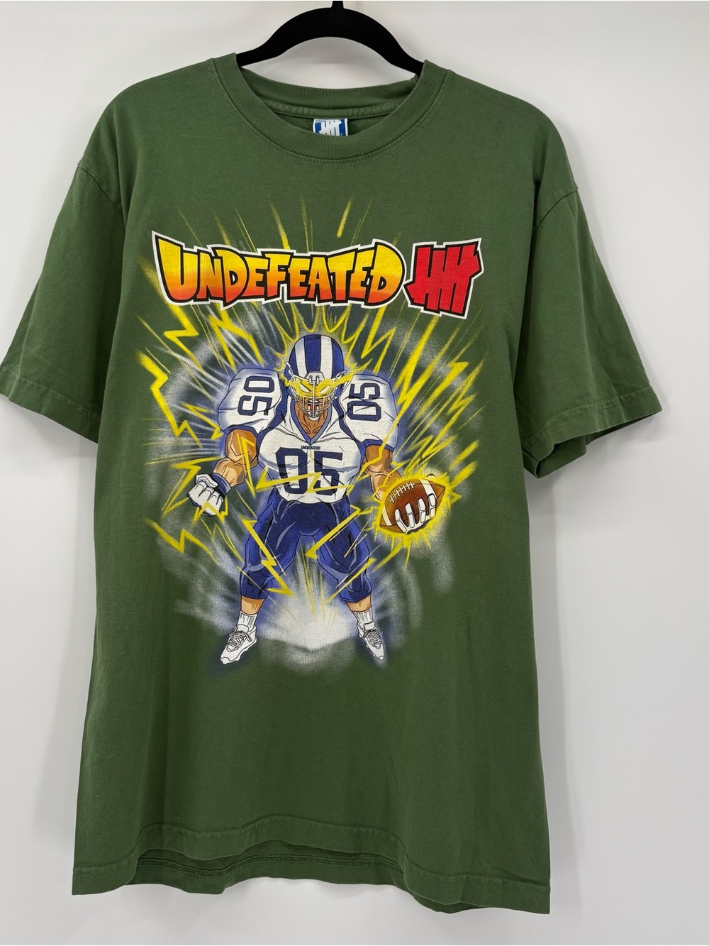 Undefeated Crewneck Tee in Olive Green with Blue Logo Tag